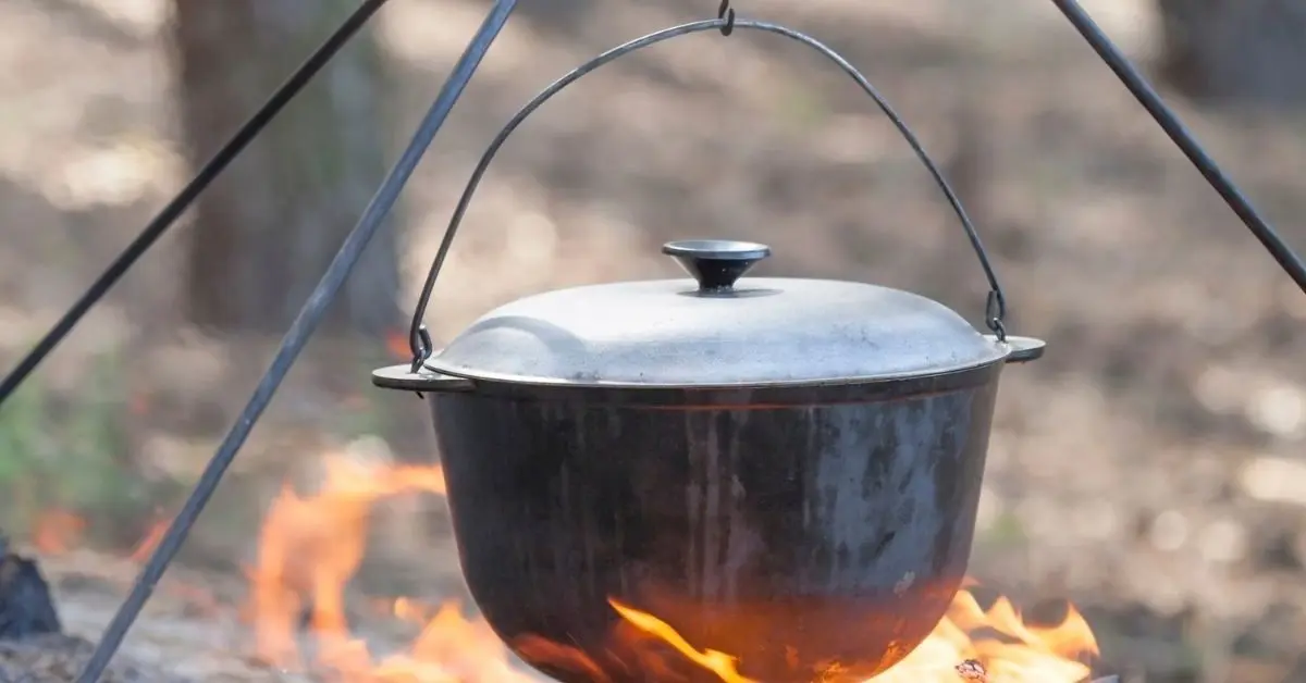 campfire cooking with a tripod
